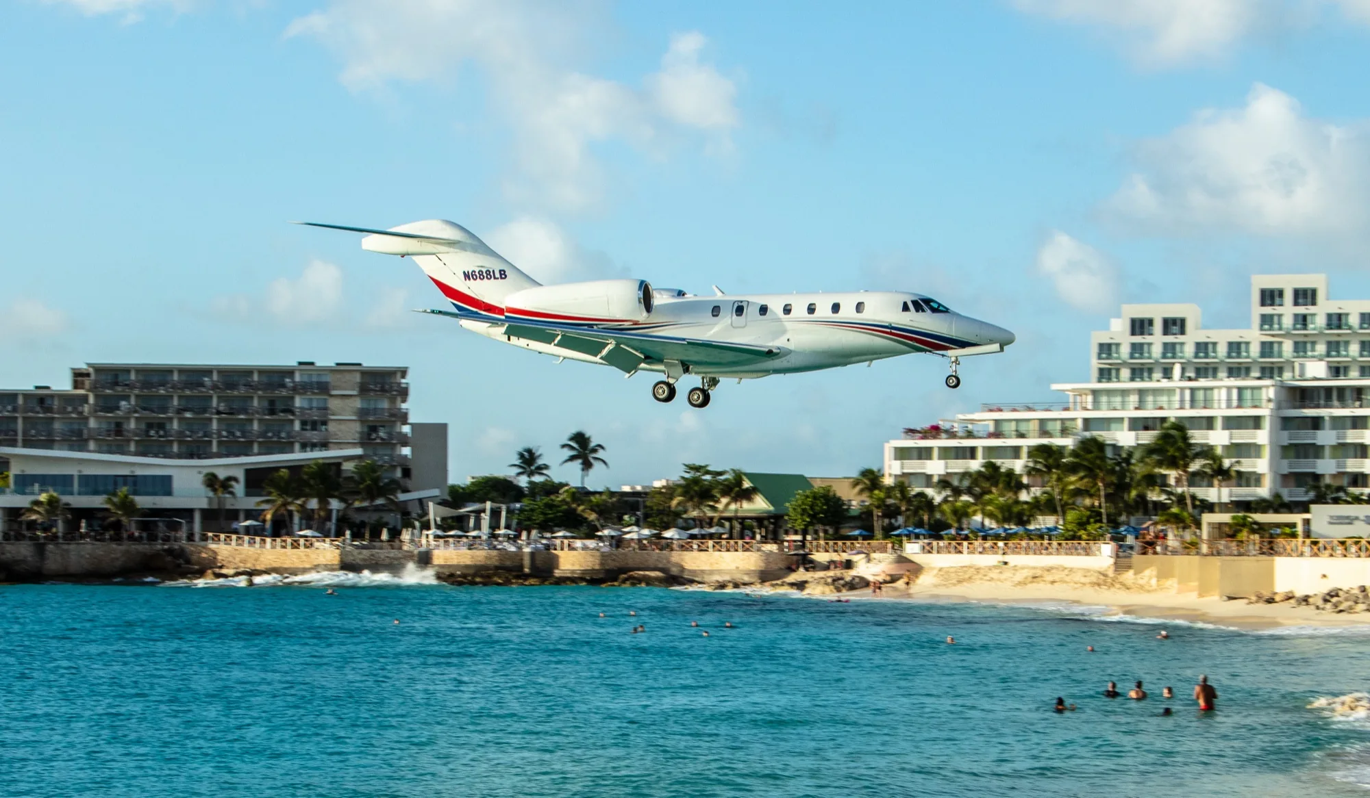 Cessna Citation X on approach over a Caribbean beach, private jet investment