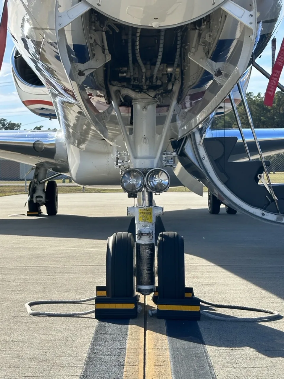 Nose gear and open service bay of a business jet, the maintenance layer of fractional jet ownership cost