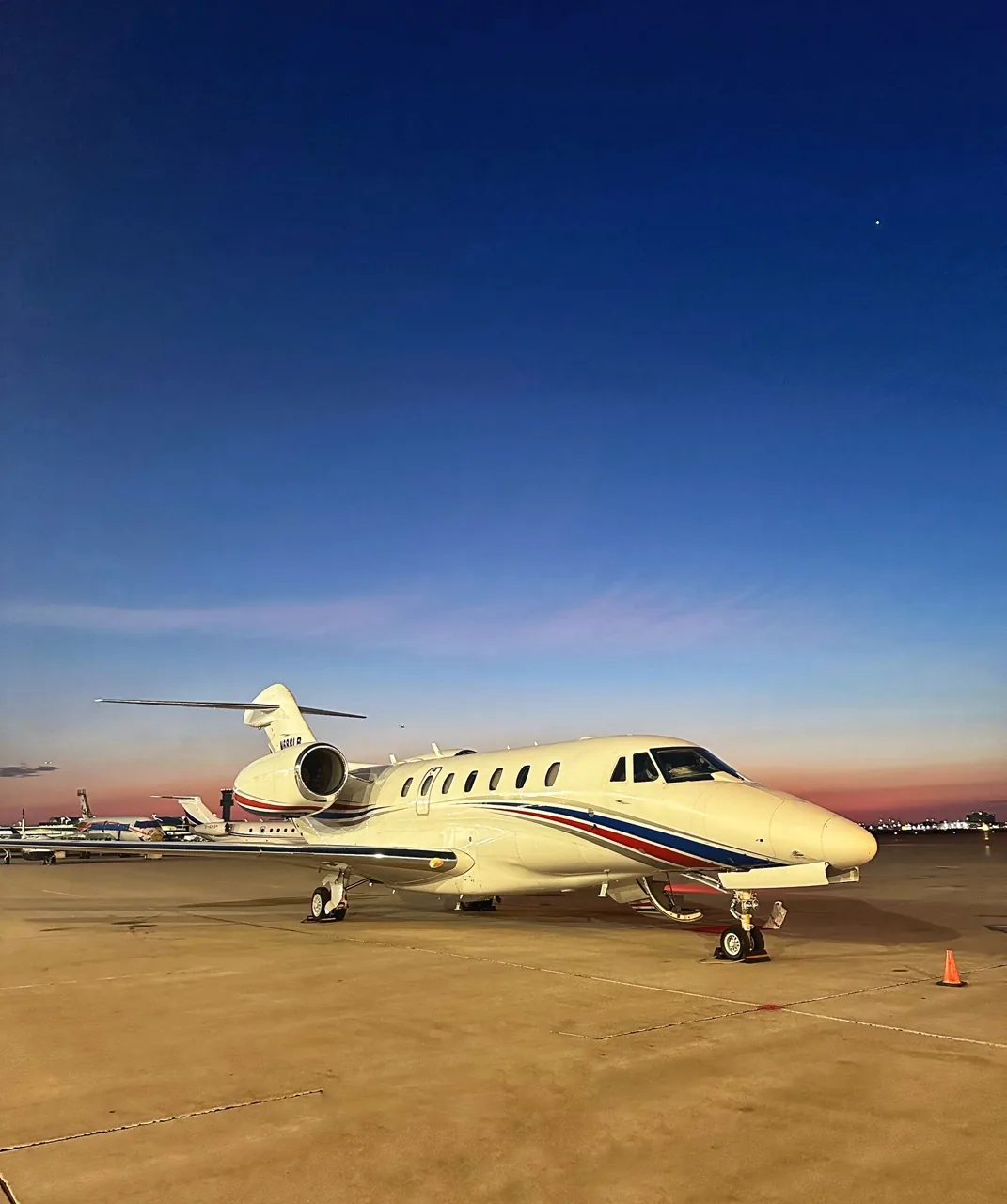 Private jet at golden hour, contact Jet Corp for charter and investment