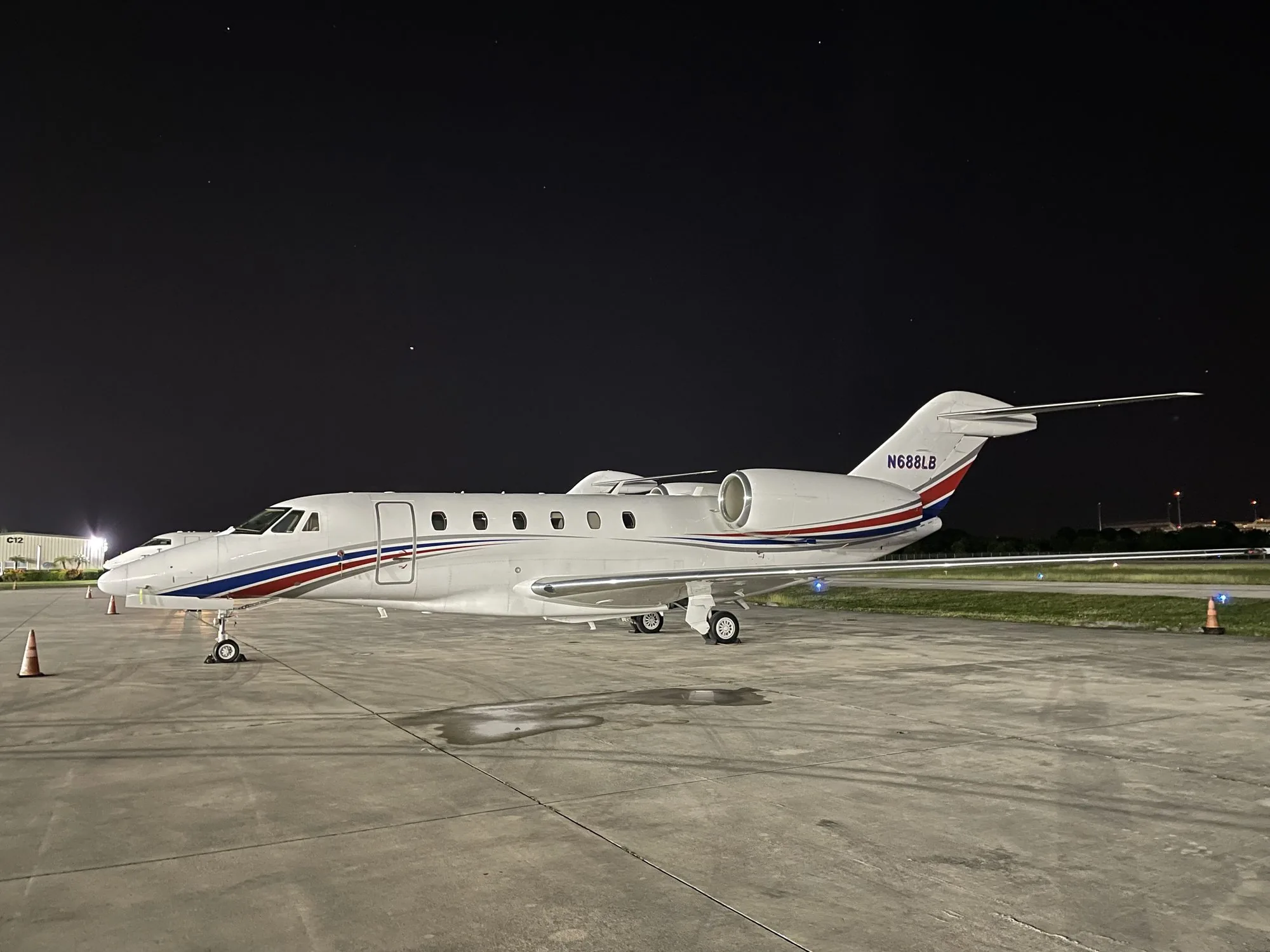 Business jet on the ramp at night, private jet tax write-off through charter placement