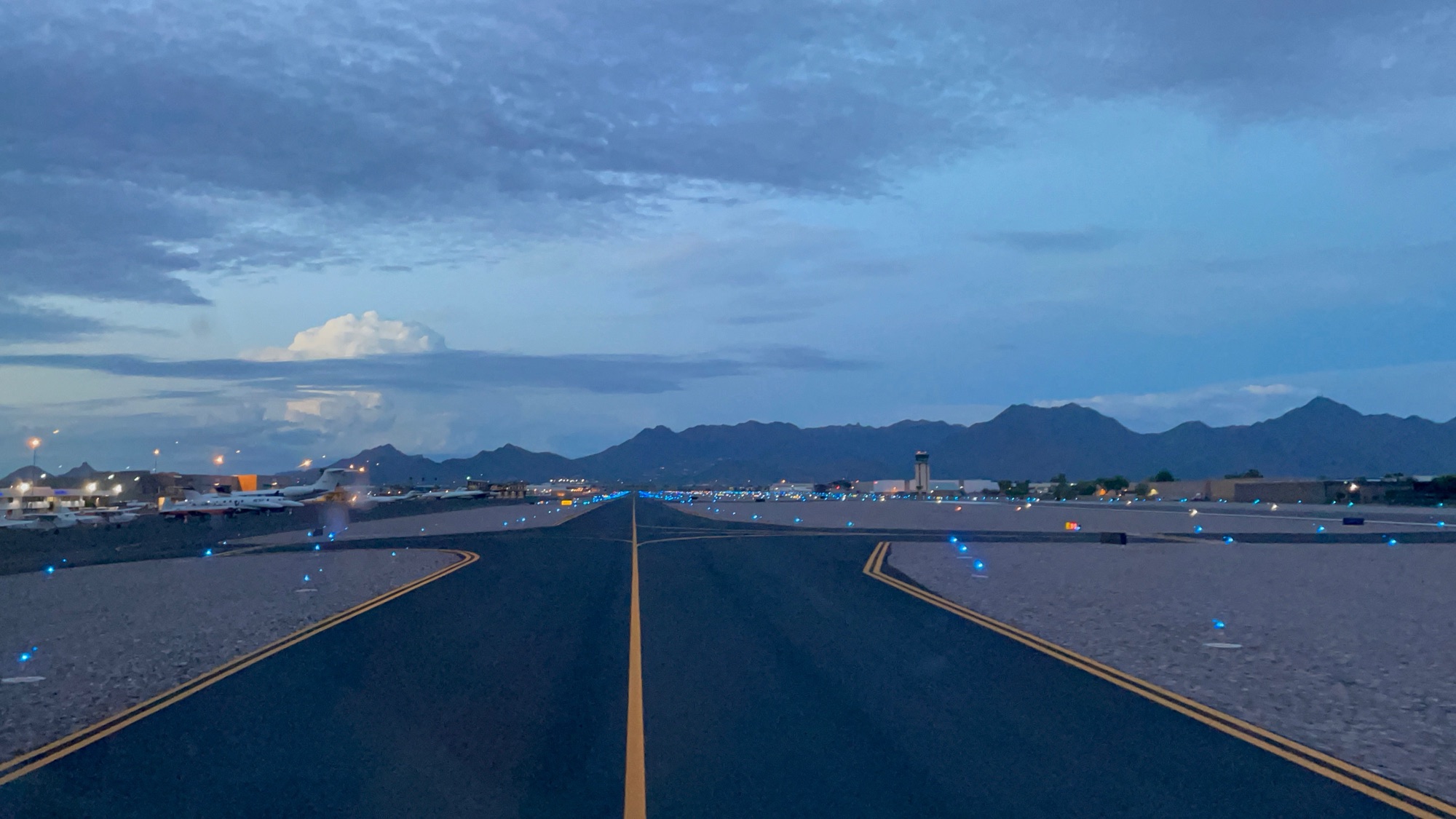 Runway and taxiway lights at blue hour, CARNIVORE private jet yield management software
