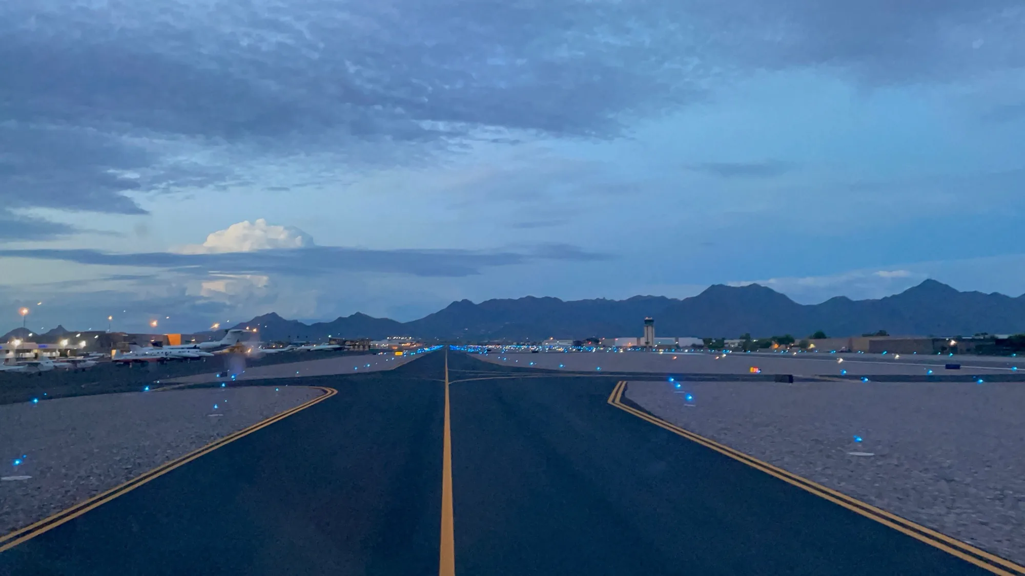 Runway and taxiway lights at blue hour, CARNIVORE private jet yield management software